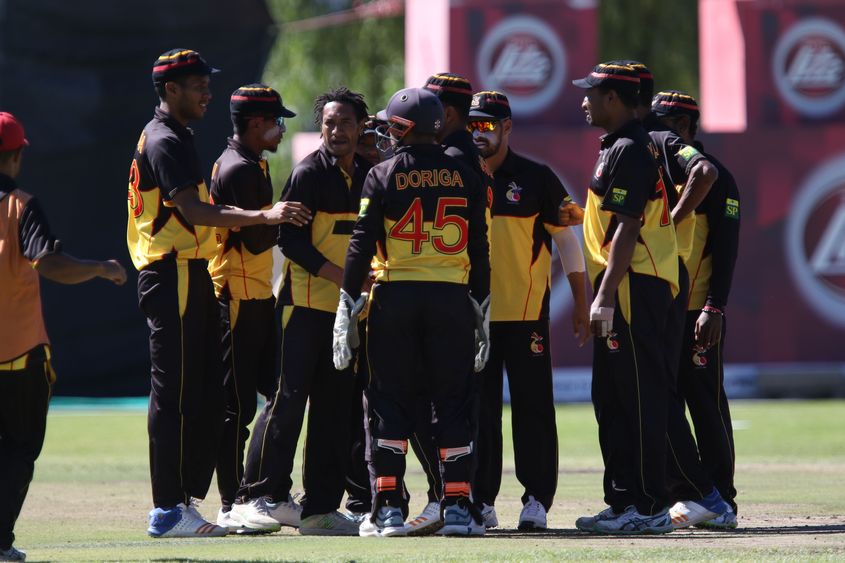 PNG plays celebrate a wicket at Wanderers